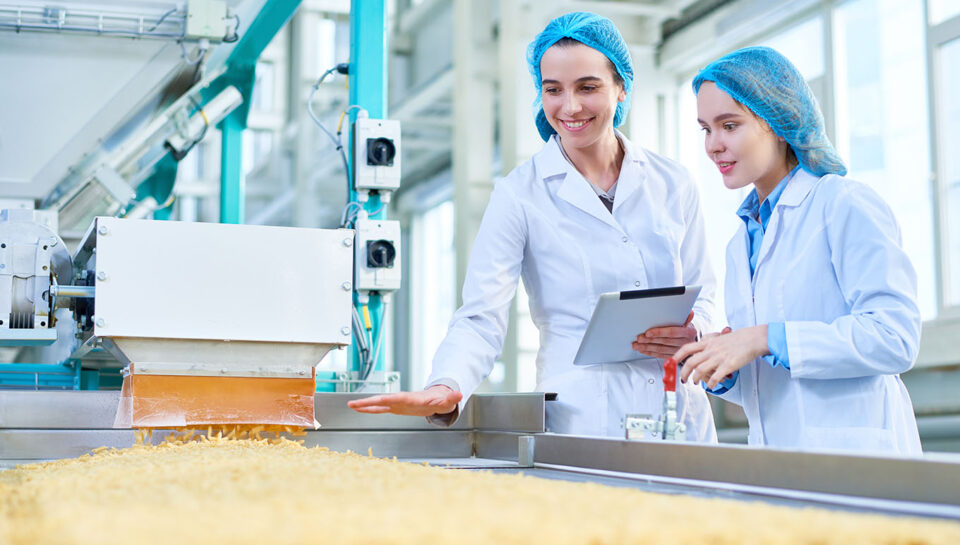 Young Women Working at Food Factory